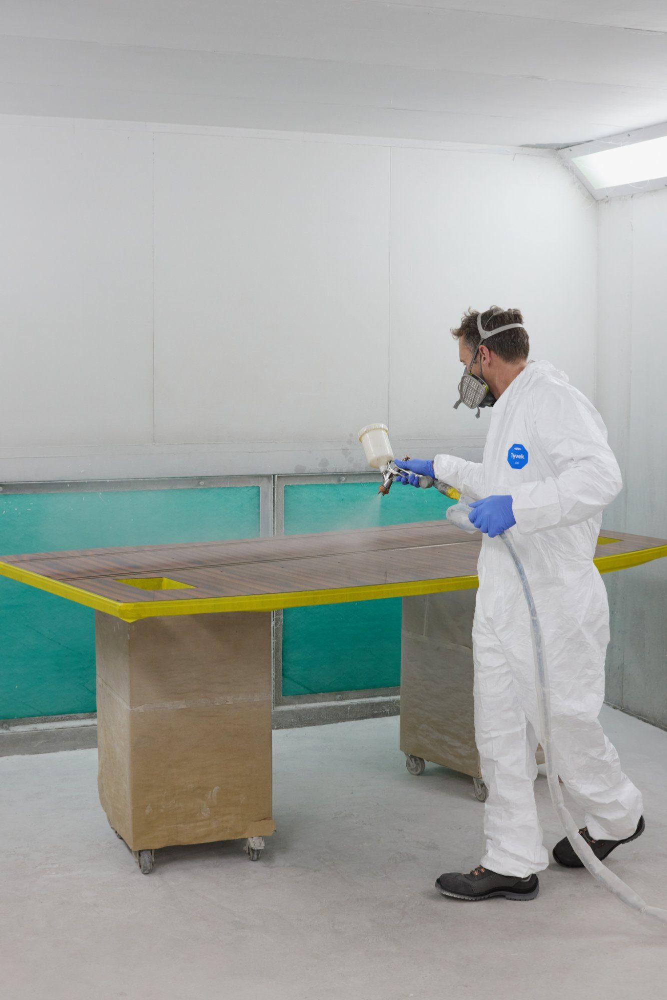 Spraying a lacquer finish onto a bespoke table top