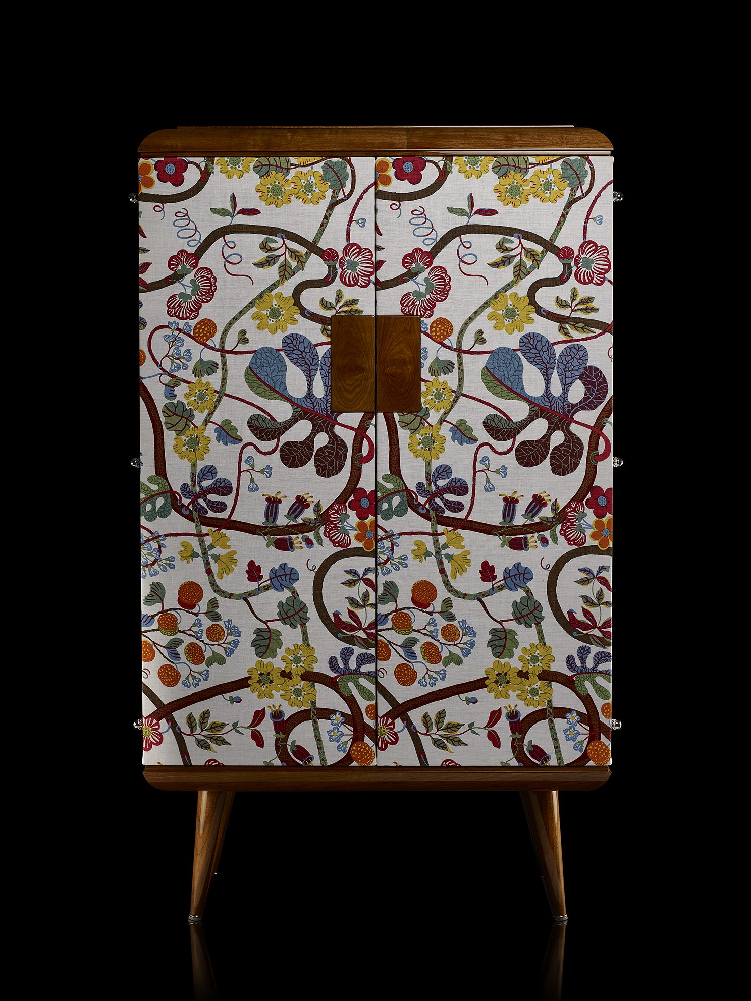 Bespoke cabinet with botanical fabric-lined doors, closed